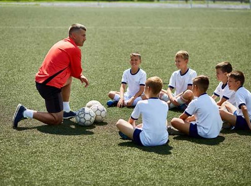 Coach in soccer field