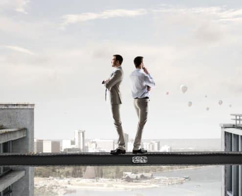 2 people disagreeing and looking in the other direction