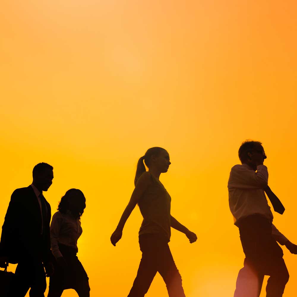 Group of people walking with yellow background