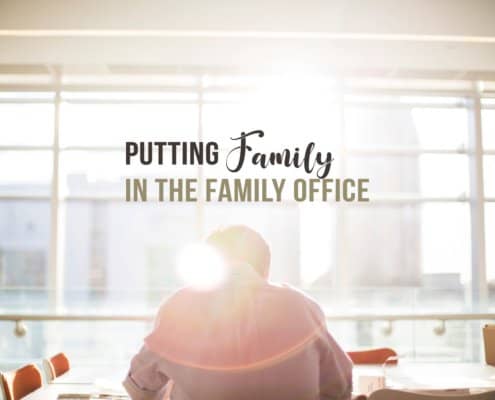 Guy sitting in his office facing a window