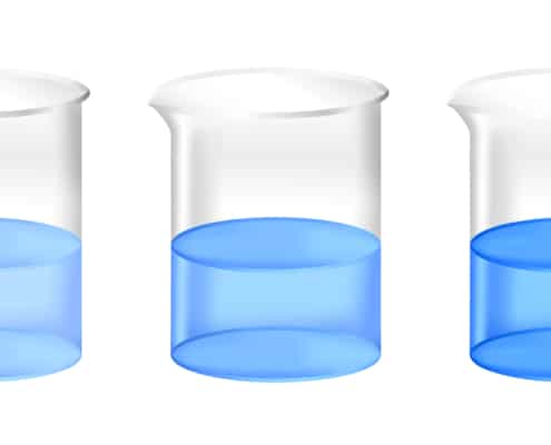 3 beakers of blue liquid on a white table