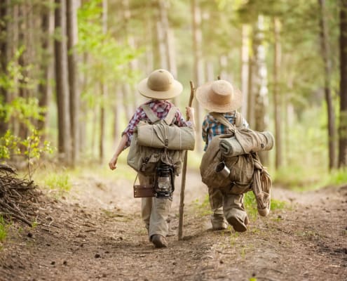Kids walking together in the woods